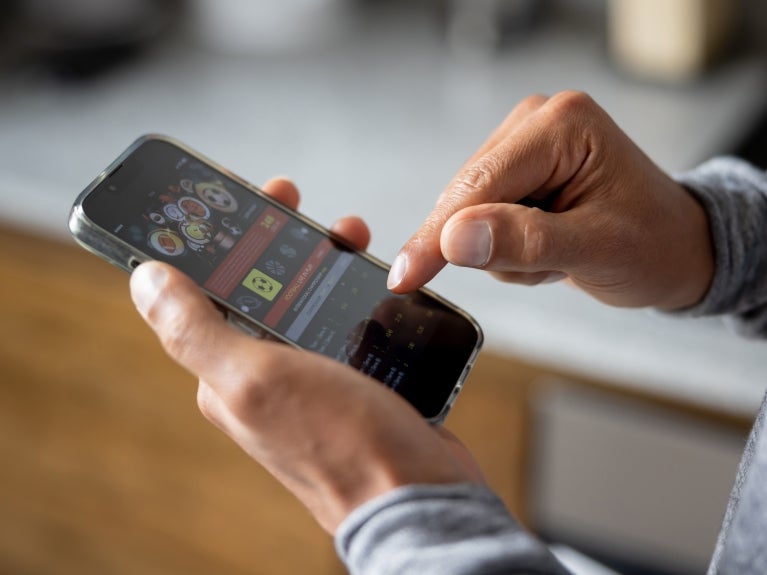 Gaming, person playing on their phone